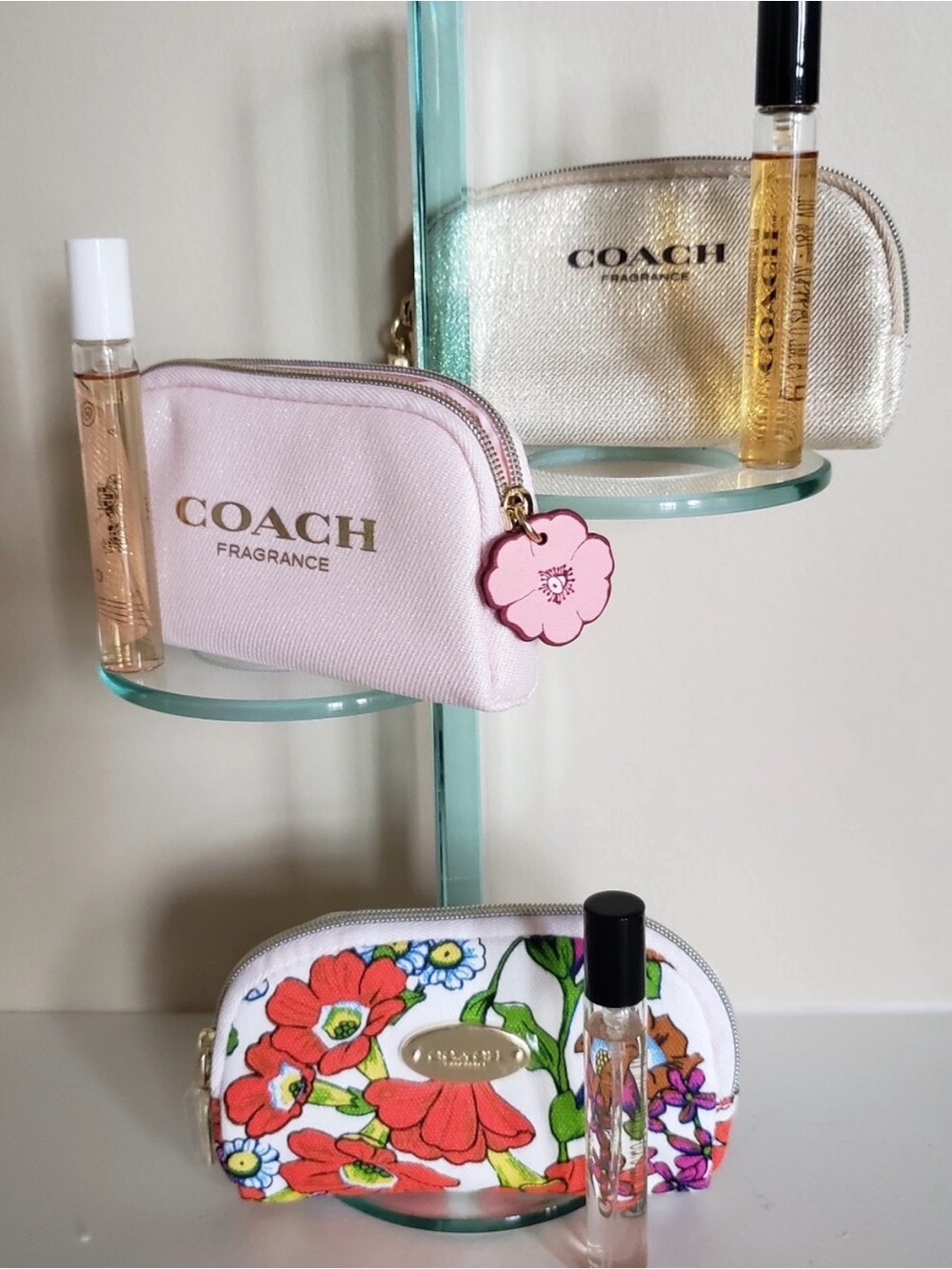 COACH
Mini Cosmetic Pouches with matching Coach 7.5ml scents